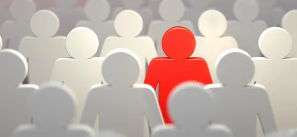 One red figure in a crowd of white figures