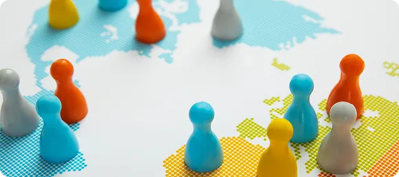 Coloured game pieces spread across a world map